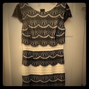 Cream and black form-fitting midi with cap sleeves